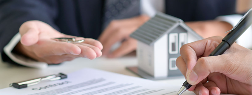 Home buyer signs the mortgage papers