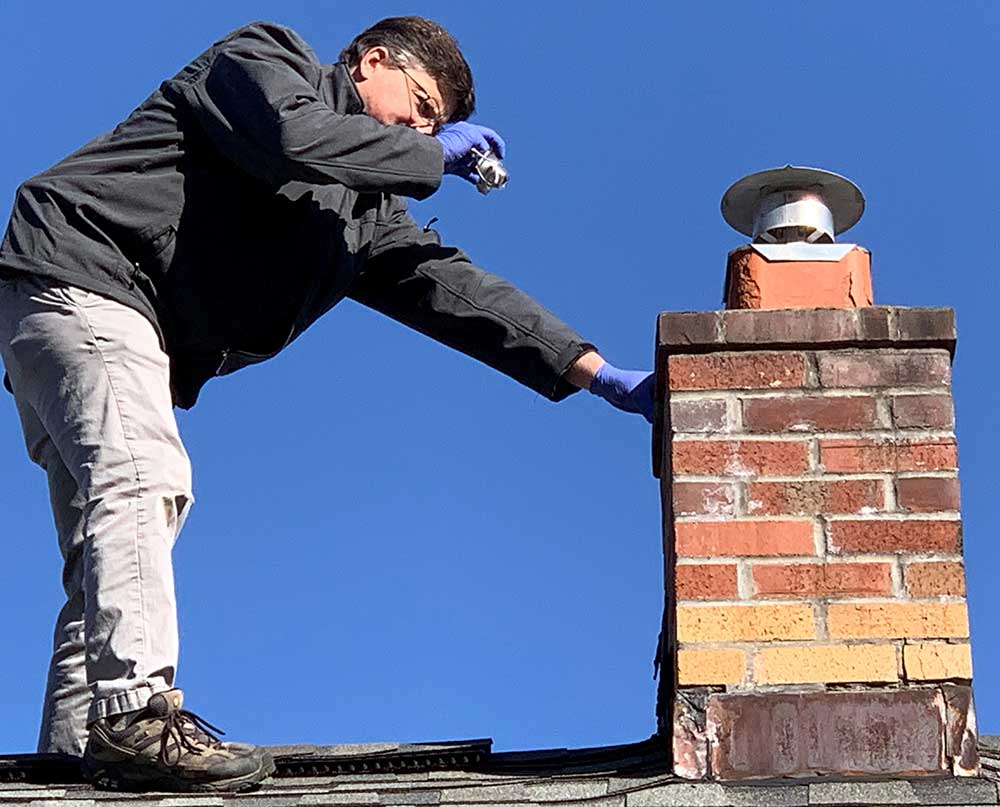 Paul Peck Inspecting Roof & Chimney