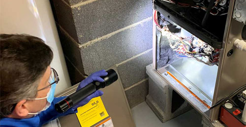 inspection of a furnace in the basement done by inspector Paul Peck